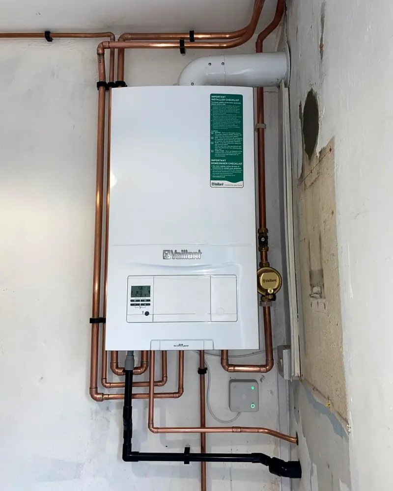 White Vaillant ecoFIT pure boiler with neat copper pipework
