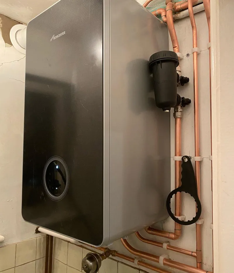 Black Worcester combi boiler with copper pipework