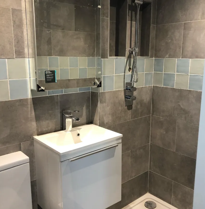 Grey tiled shower room fitted by MST