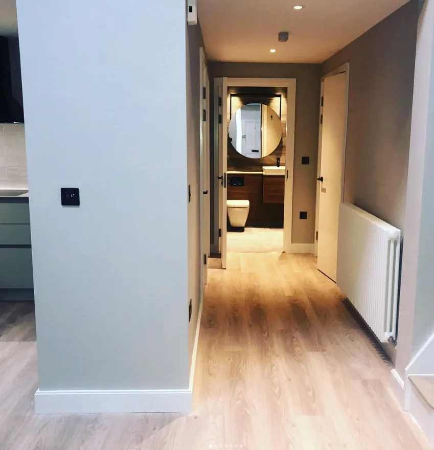 Hallway with column radiator leading to the bathroom